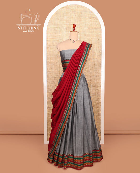 Grey plain cotton half-saree with contrast traditional motifs woven thread bordered skirt, matching blouse, and a contrast traditional bordered dhavani