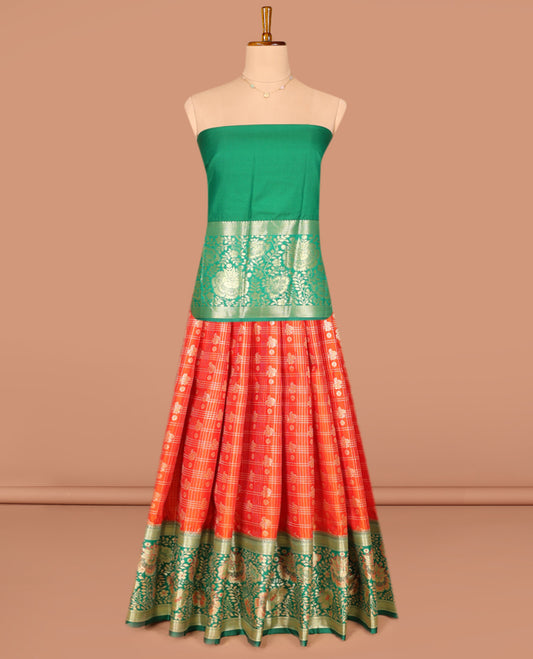 Orange Art Silk Pavadai Material Set, Richly Detailed with Zari Butta Enclosed Checks on Its Skirt, Complemented by a Contrast Floral Zari Designs Woven Border, and Paired with a Contrast Blouse