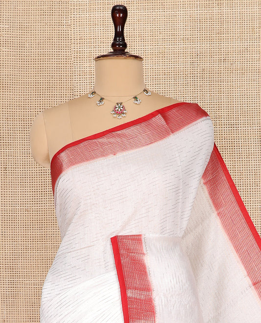 White Assam Silk Saree Finely Woven with Zig-Zag Stripes on Its Body, Complemented by a Contrast Traditional Zari Design Border, Sparkling Zari-Woven Pallu, and Paired with a Contrast Blouse