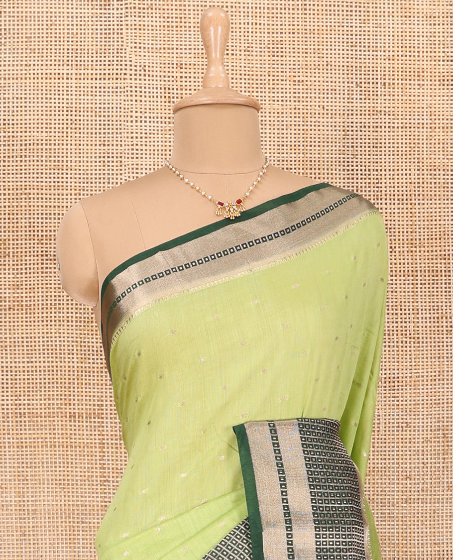Pista Green Assam Silk Saree Adorned with All-Over Buttas, Featuring a Contrast Temple Border of Butta Enclosed Checked Design, a Pallu Steeped with Zari Stripes, and Paired with a Contrast Zari Design Blouse