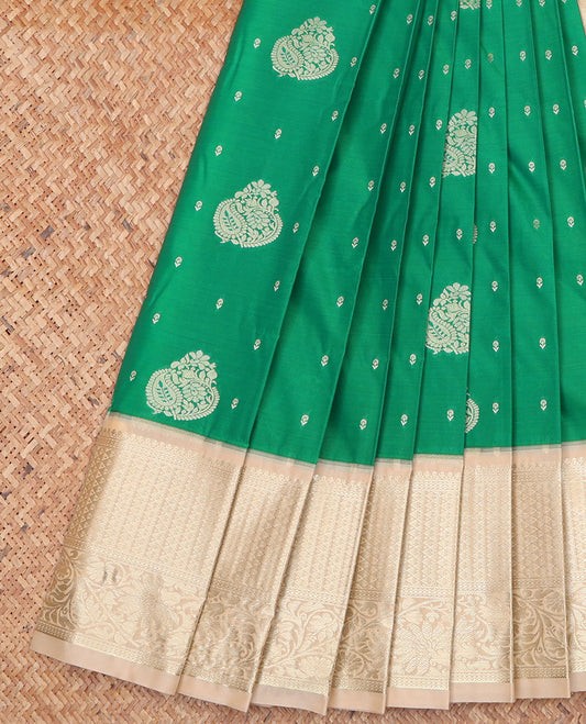 Green Budget Silk Saree, Styled with Zari Buttas on Its Body, Complemented by a Contrast Traditional Zari Design Border, Pallu of Paisley and Strip Designs, and Paired with a Contrast Blouse