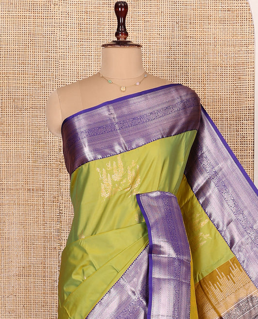 Green Budget Silk Saree, Prettied with Zari Buttas All Over Its Body, Complemented by a Contrast Border of Traditional Designs Woven in Zari, Pallu Detailed with Chevron Designs, and Paired with a Contrast Blouse