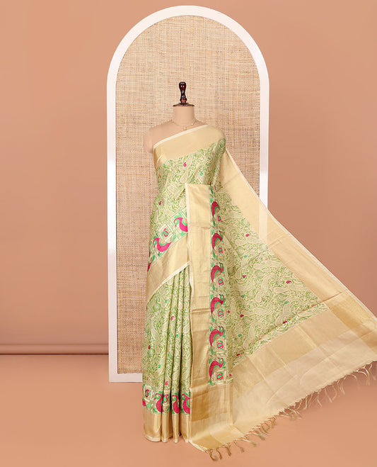 Green Tissue Cotton Saree, Adorned with Paisley Print and Paisley-Bird Motifs Embroidery on Its Body, Subtle Bavanji Border, Pallu Mirrors the Same Print, and Paired with a Matching Blouse