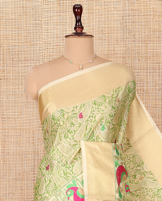 Green Tissue Cotton Saree, Adorned with Paisley Print and Paisley-Bird Motifs Embroidery on Its Body, Subtle Bavanji Border, Pallu Mirrors the Same Print, and Paired with a Matching Blouse
