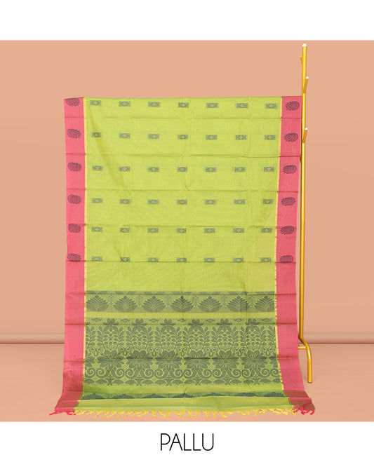 Leaf Green Kanchi Cotton Saree, Crafted with Buttas All Over Its Body, Complemented by Contrast Border, Pallu of Floral Designs, and Paired with a Matching Blouse