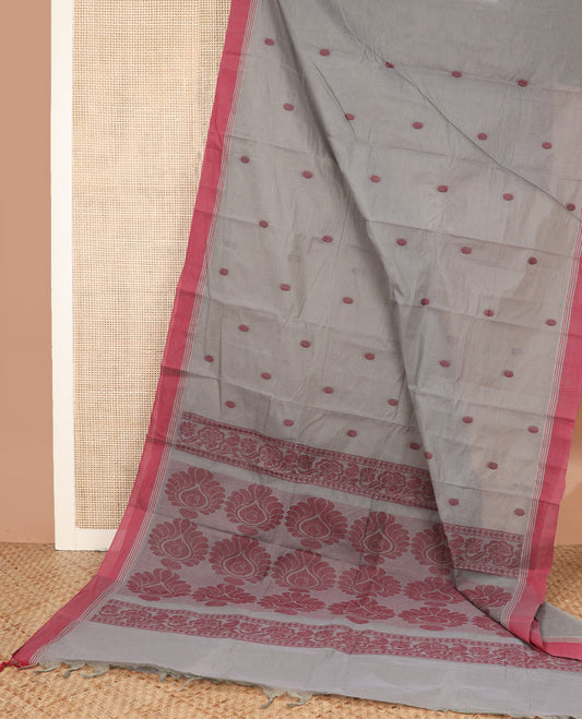 Grey polka dot buttas kanchi cotton saree, contrast border, and intricate design pallu