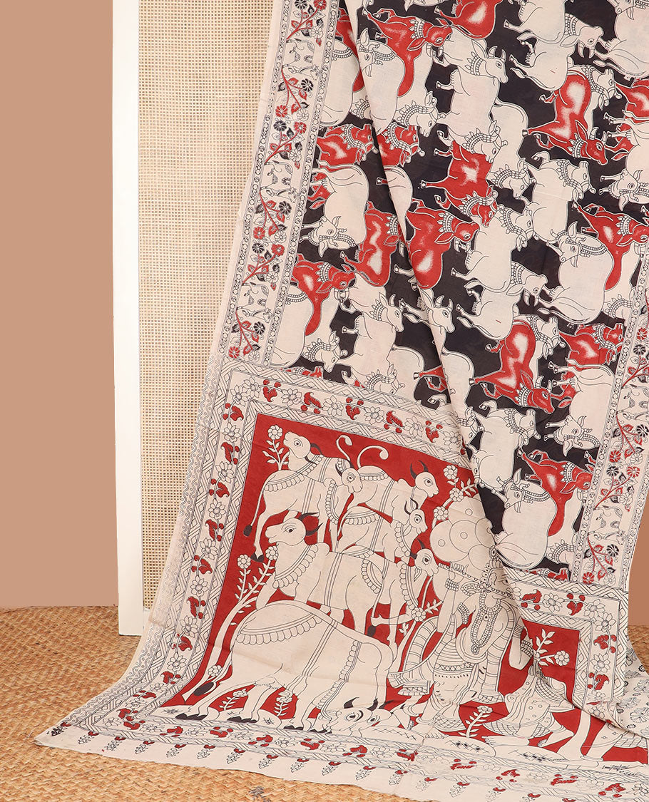 Black base Pichwai cow machine-printed cotton saree, contrast floral creeper border, and pallu of Pichwai cow, and Radha Krishnan motifs