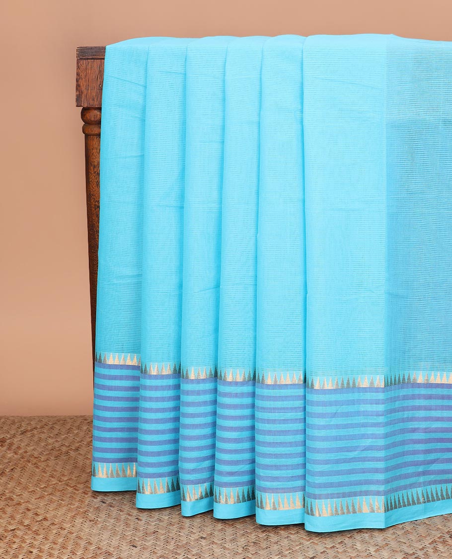 Blue plain Mangalagiri cotton saree with temple zari border of horizontal stripes, striped pallu, and a contrast kalamkari floral printed blouse