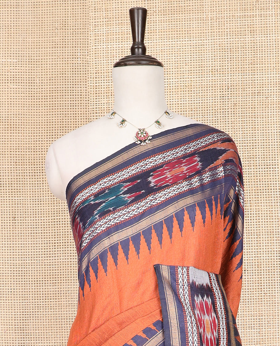 Orange Plain Dupion Silk Saree, Highlighted by a Contrast Temple Border of Geometric Patterns and Ikkat Weave, Pallu Depicting Floral Ikkat Designs, and Paired with a Contrast Blouse