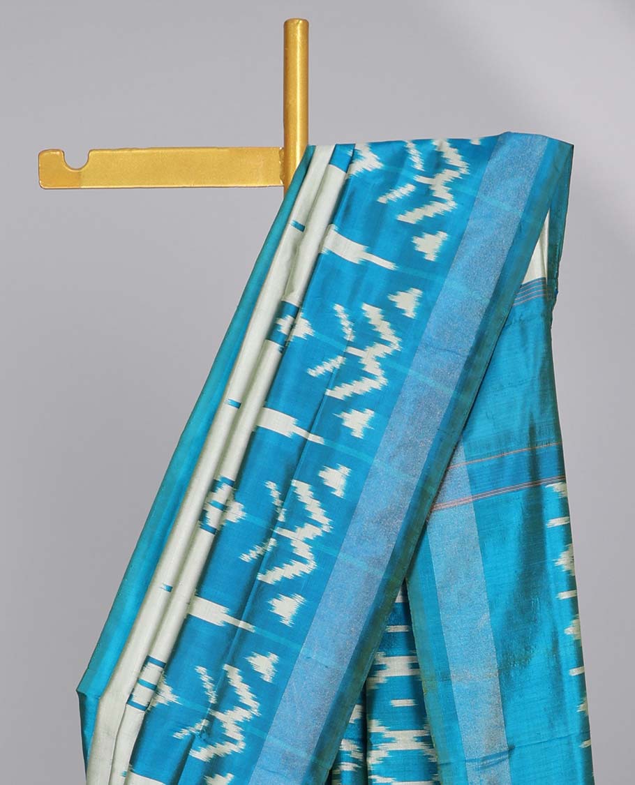 Purple geomentric design ikkat silk saree with contrast striped border & striped design pallu