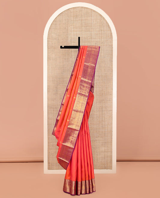 Orange Kanchipuram Silk Saree, Gracefully Embellished with Mayil Buttas, Complemented by a Contrast Border of Thilakam Mokku, Rudaraksham, Mayil Kann, Chakram, Yaanai, Mayil, and Jaal Designs, Pallu of Zari Designs, and Paired with a Contrast Blouse