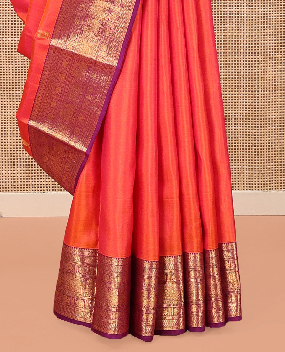 Orange Kanchipuram Silk Saree, Gracefully Embellished with Mayil Buttas, Complemented by a Contrast Border of Thilakam Mokku, Rudaraksham, Mayil Kann, Chakram, Yaanai, Mayil, and Jaal Designs, Pallu of Zari Designs, and Paired with a Contrast Blouse