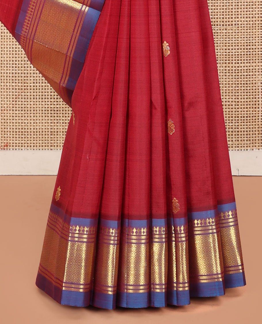Red Kanchipuram Silk Saree, Decked Up with Zari Buttas, a Contrast One-Sided Border of Panner Sombu, Banaras, and Mayil Kann, Zari Design Pallu, and No Blouse