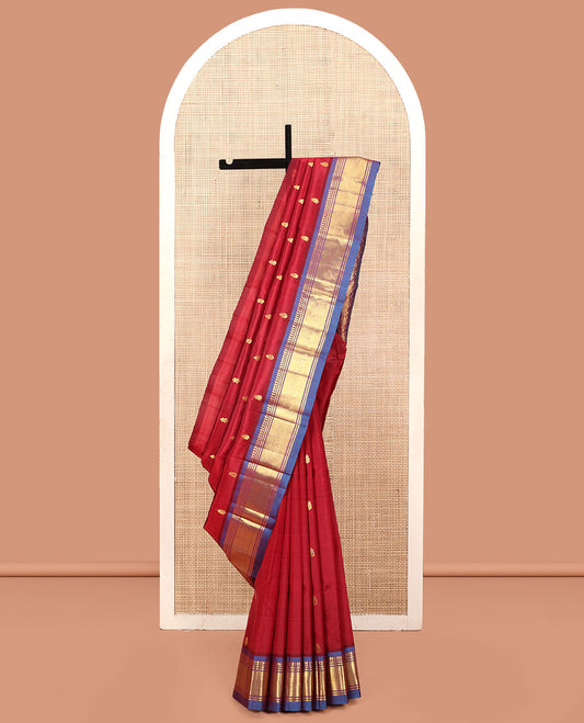 Red Kanchipuram Silk Saree, Decked Up with Zari Buttas, a Contrast One-Sided Border of Panner Sombu, Banaras, and Mayil Kann, Zari Design Pallu, and No Blouse