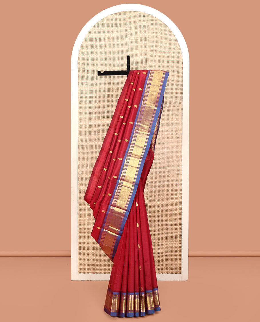Red Kanchipuram Silk Saree, Decked Up with Zari Buttas, a Contrast One-Sided Border of Panner Sombu, Banaras, and Mayil Kann, Zari Design Pallu, and No Blouse