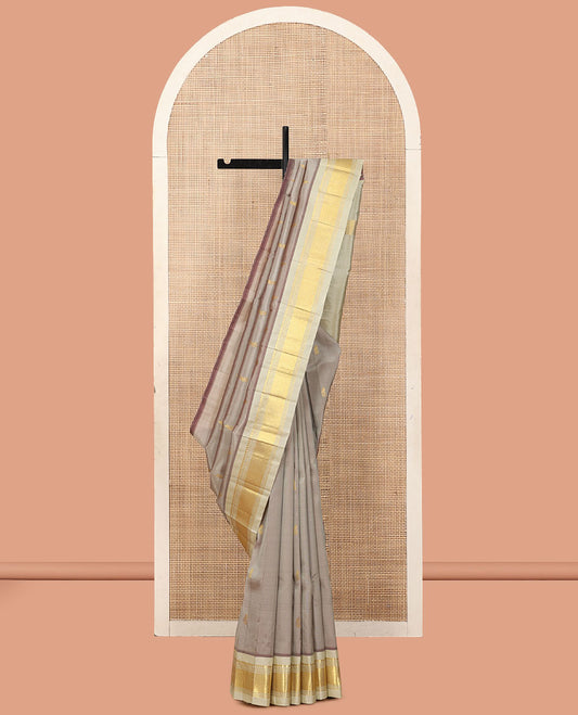 Grey Kanchipuram Silk Saree, Woven with Zari Buttas, a Contrast One-Sided Border of Panner Sombu, Banaras, Muthu, and Mayil Kann Designs, a Zari Design Pallu, and No Blouse