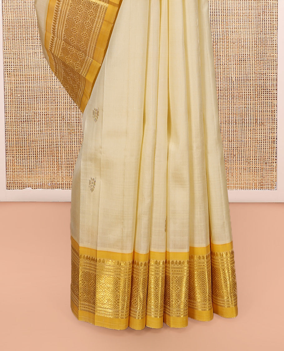 Sandal Kanchipuram Silk Saree, Subtly Sparkled with Zari Buttas, a Contrast One-Sided Border of Thilakam Mokku, Banaras, Muthu, and Jaal Designs, Zari Design Pallu, and No Blouse