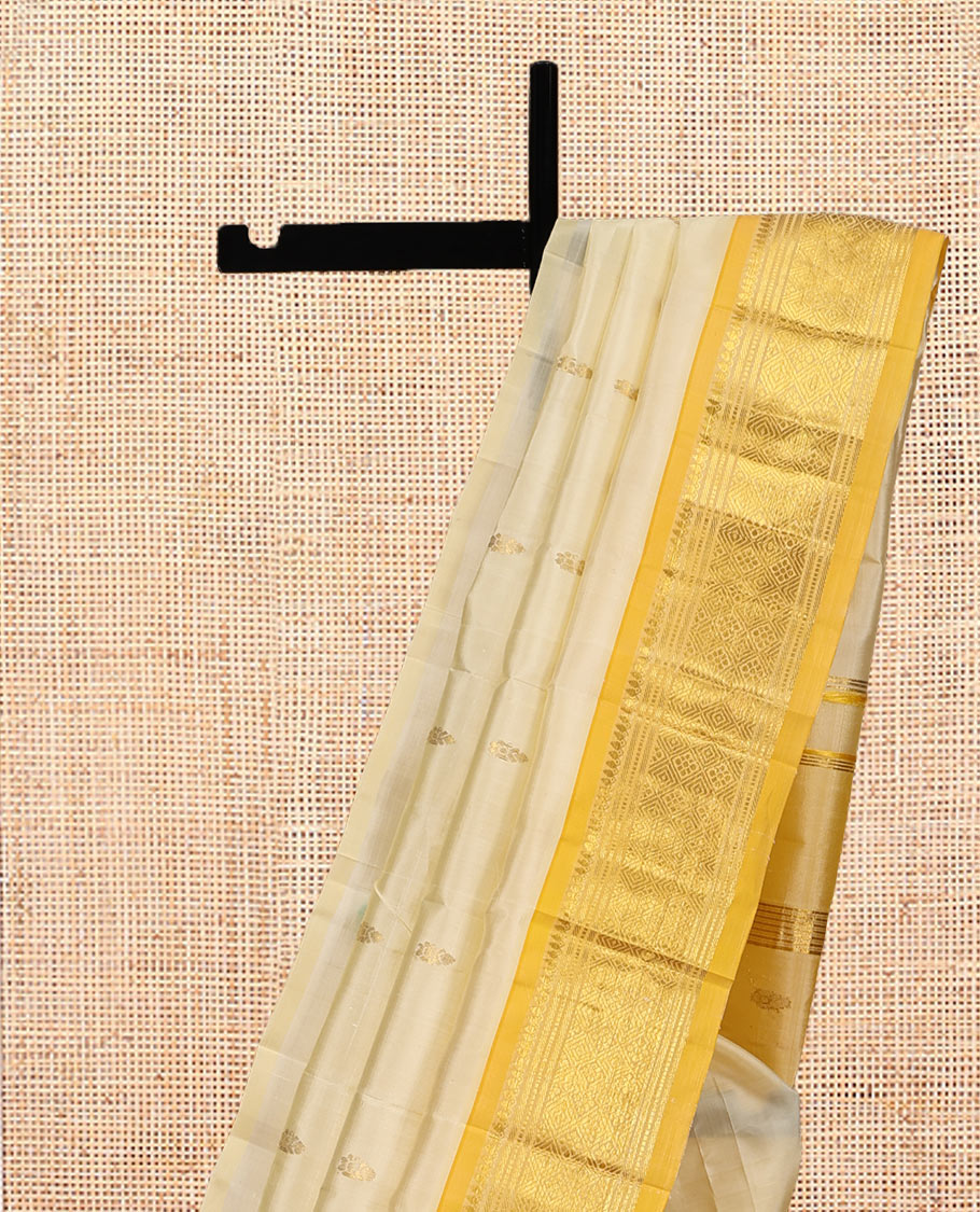 Sandal Kanchipuram Silk Saree, Subtly Sparkled with Zari Buttas, a Contrast One-Sided Border of Thilakam Mokku, Banaras, Muthu, and Jaal Designs, Zari Design Pallu, and No Blouse