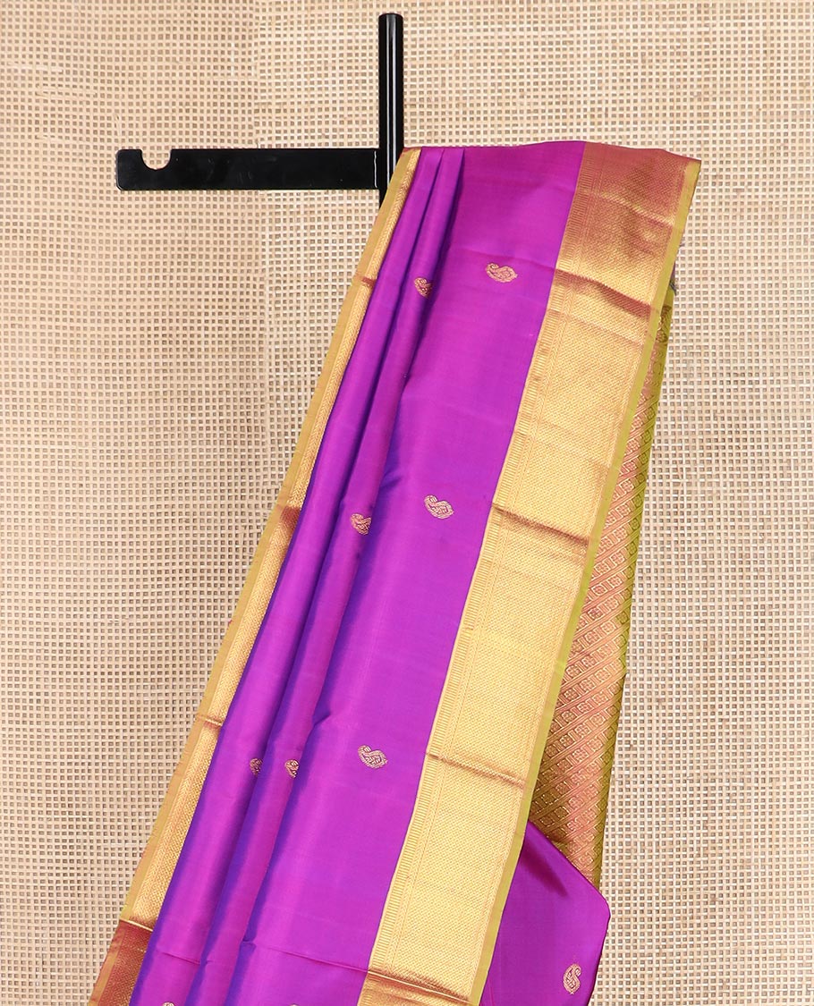 Rani pink zari buttas Kanchipuram silk saree, contrast traditional zari border, and kamalam designs steeped pallu