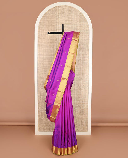 Rani pink zari buttas Kanchipuram silk saree, contrast traditional zari border, and kamalam designs steeped pallu