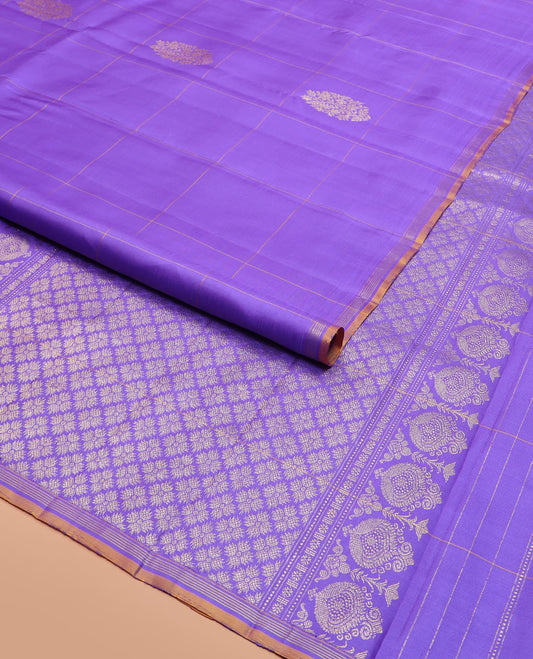Lavender Kanchipuram Silk Saree Featuring Buttas Enclosed Checks, Adorned with a Contrast Piping Border, Zari Elevated Pallu of Jaal Design, and Paired with a Matching Checked Blouse
