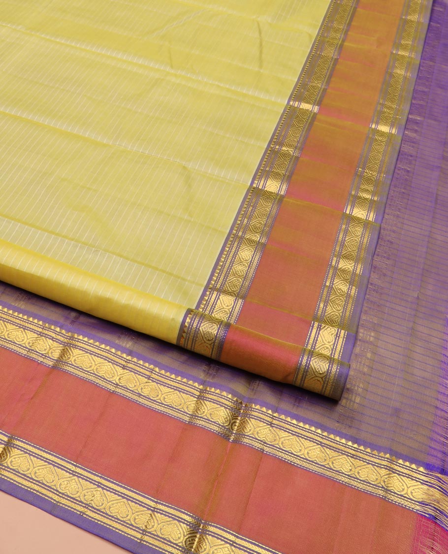 Pale Yellow Kanchipuram Silk Saree Embellished with Vazhaipoo Stripes, Complemented by Contrast Rettai Pettu Border of Rekku, Kathir, Muthu, and Jada Nagam Designs, Zari Woven Pallu, and Paired with a Contrast Blouse