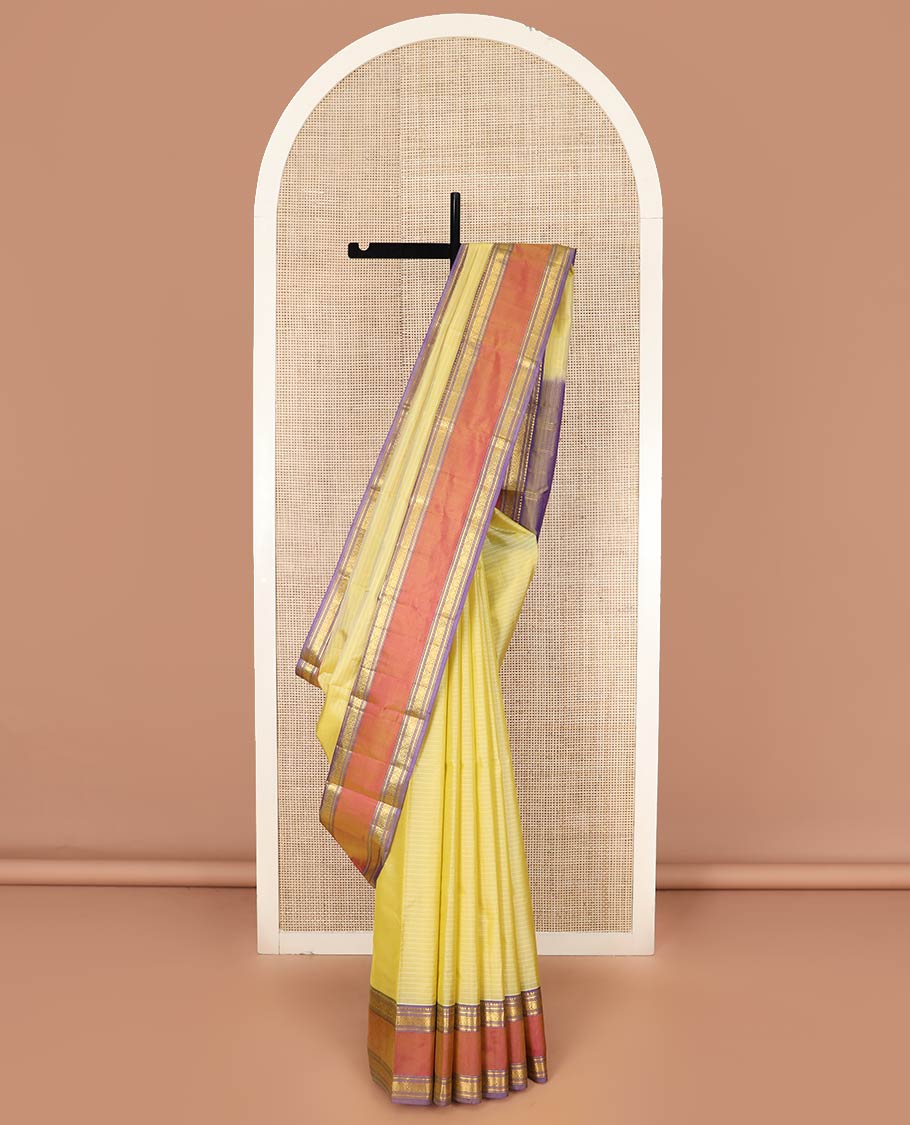 Pale Yellow Kanchipuram Silk Saree Embellished with Vazhaipoo Stripes, Complemented by Contrast Rettai Pettu Border of Rekku, Kathir, Muthu, and Jada Nagam Designs, Zari Woven Pallu, and Paired with a Contrast Blouse