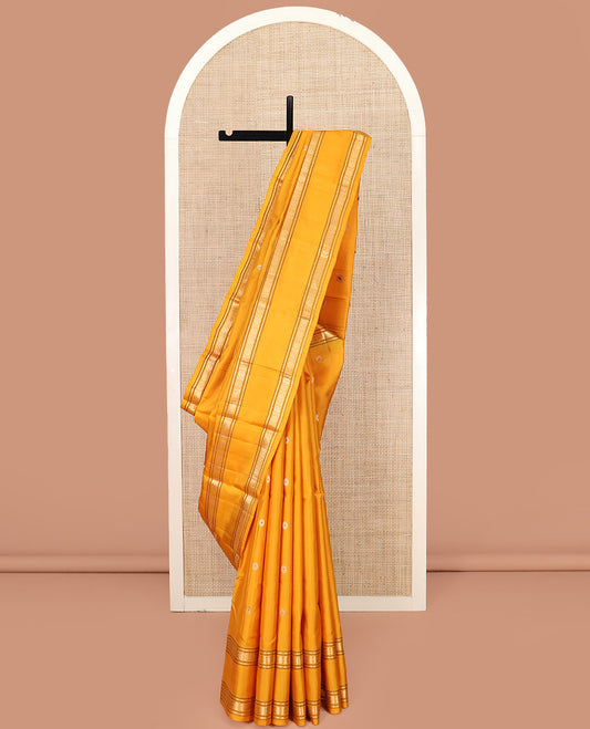 Yellow Kanchipuram Silk Saree Elevated with Chakram Buttas on Its Body, Highlighted by a Self-Border of Muthu, Banaras, and Chakram Designs, Pallu Artfully Woven with Meenakari Annam Chakram Designs, and Paired with a Matching Blouse