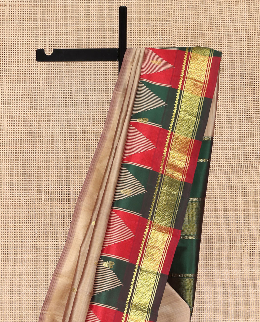 Sandal Kanchipuram Silk Saree, Elevated with Zari Buttas on Its Body, Complemented by a Contrast One-Sided Temple Border of Thilakam Mokku, and Jaal Designs, Pallu Depicts Zari Designs, and Comes Without a Blouse