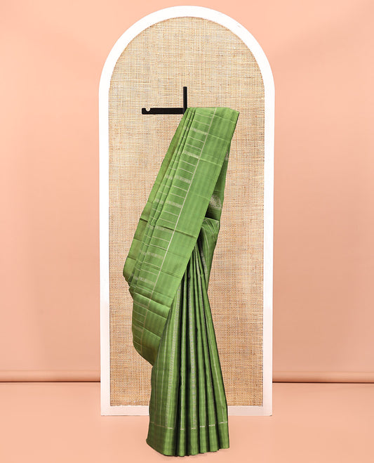 Green Mayuri Soft Silk Saree, Subtly Decked Up Zari Stripes All Over Its Body, Highlighted by Self-Border, Pallu Steeped with Elephant Motifs, and Paired with a Matching Blouse