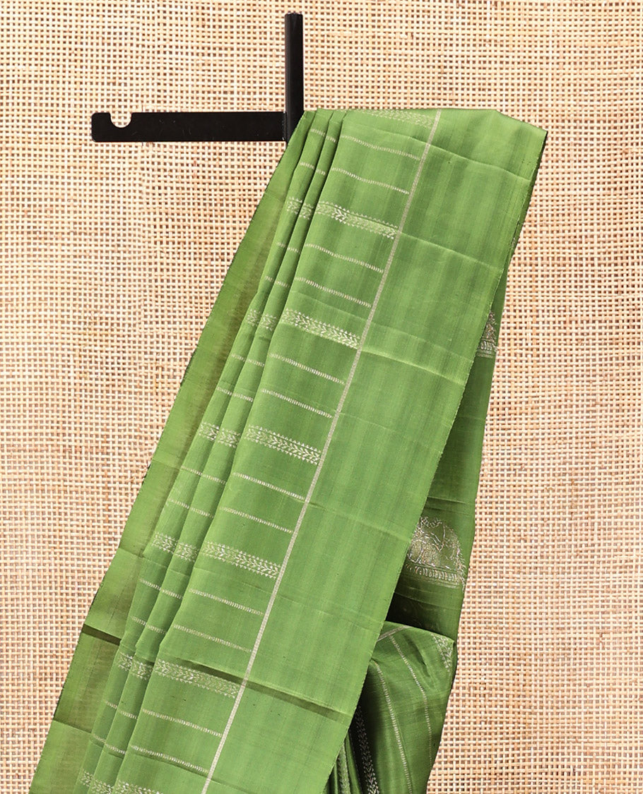 Green Mayuri Soft Silk Saree, Subtly Decked Up Zari Stripes All Over Its Body, Highlighted by Self-Border, Pallu Steeped with Elephant Motifs, and Paired with a Matching Blouse