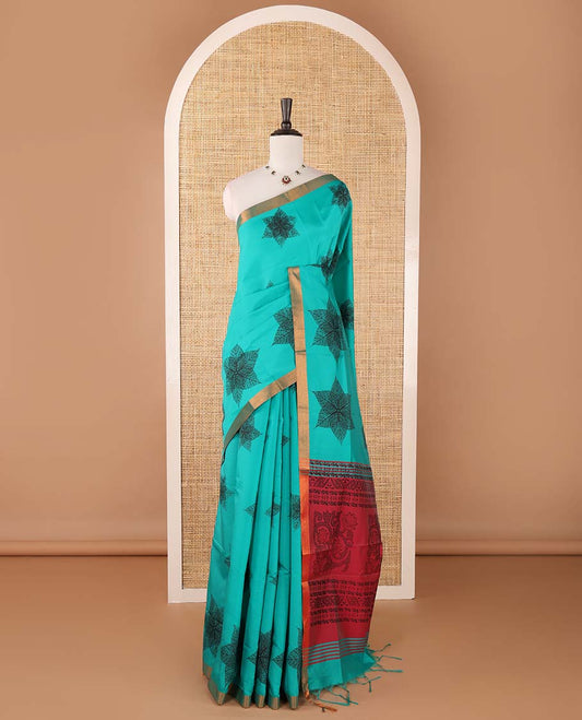Blue six-petal-like leaf motifs printed micro-silk saree, copper zari border, contrast intricate pallu & plain blouse