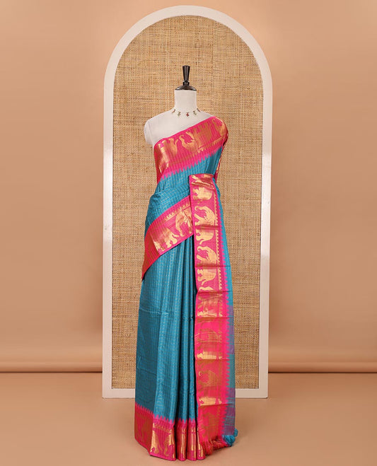 Blue checked semi-tafeta saree, contrast temple zari elephant motifs border, striped pallu & matching checked zari border blouse