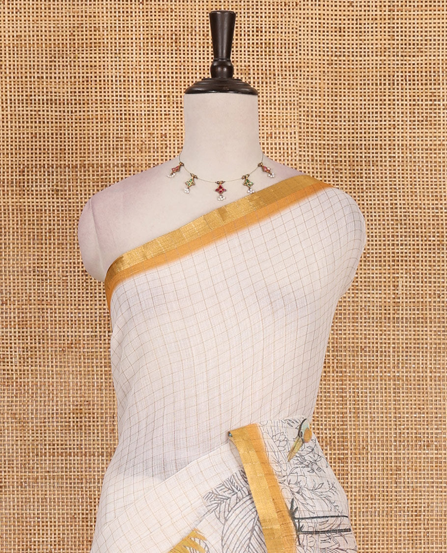 White with mustard zari checks linen saree with contrast border and unique designs of pallu along with contrast plain blouse