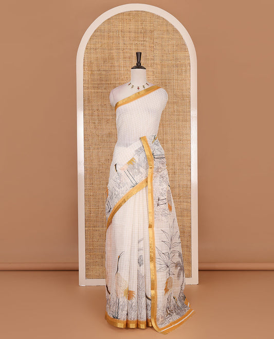 White with mustard zari checks linen saree with contrast border and unique designs of pallu along with contrast plain blouse