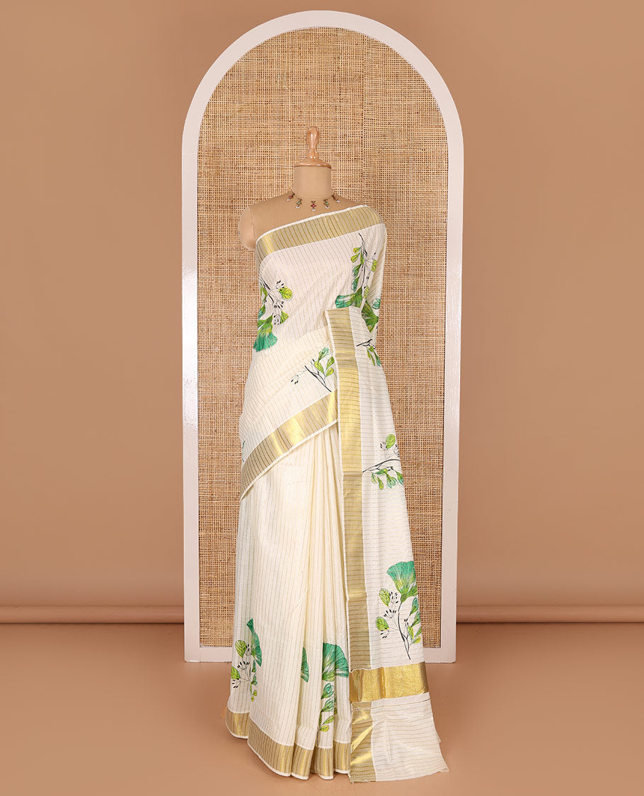 Cream and green vertically striped with handblock floral motifs printed Kerala cotton saree, zari striped border, handblock floral printed pallu, and a matching blouse