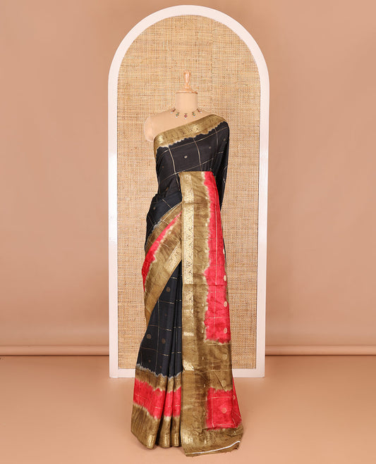 Black buttas enclosed checked dola silk saree, contrast shibori print with traditional zari border, buttas enclosed checked pallu, and a contrast buttas enclosed checked blouse