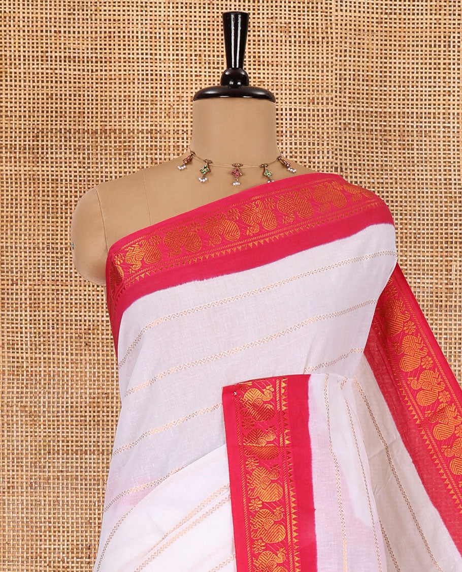 Half-white and rani pink Veldhari striped Sungudi cotton saree, contrast traditional border of peacock buttas, zari striped pallu, and a contrast blouse