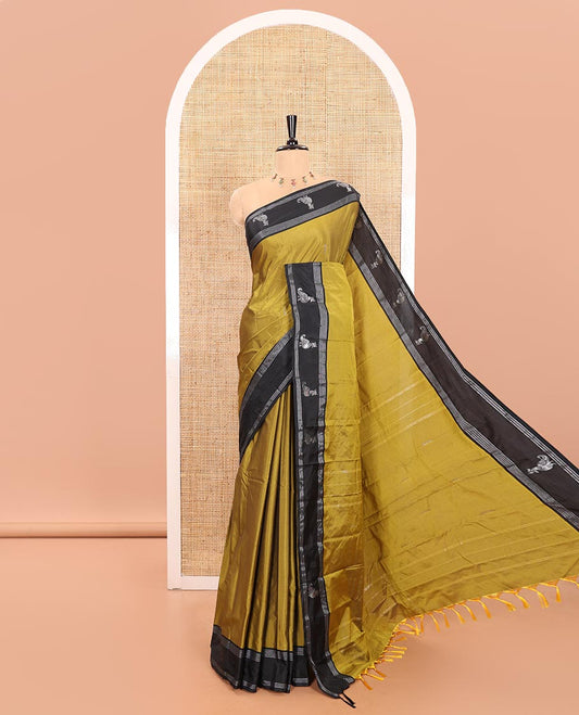 Mehendi Green Semi-Soft Silk Saree Featuring Zari Buttas Woven Across Its Body, Complemented by a Contrast Peacock Motifs Zari Border, Subtly Made Self-Pallu, and a Matching Blouse