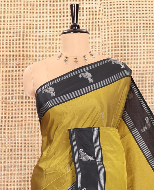 Mehendi Green Semi-Soft Silk Saree Featuring Zari Buttas Woven Across Its Body, Complemented by a Contrast Peacock Motifs Zari Border, Subtly Made Self-Pallu, and a Matching Blouse