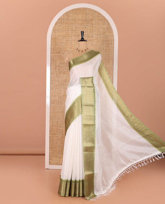 White and Green Dola Silk Saree Elevated with Vertical Zari Stripes All Over the Body, Complemented by a Contrast Border of Traditional Zari Designs, Self-Pallu of Stripes, and Paired with a Contrast Blouse