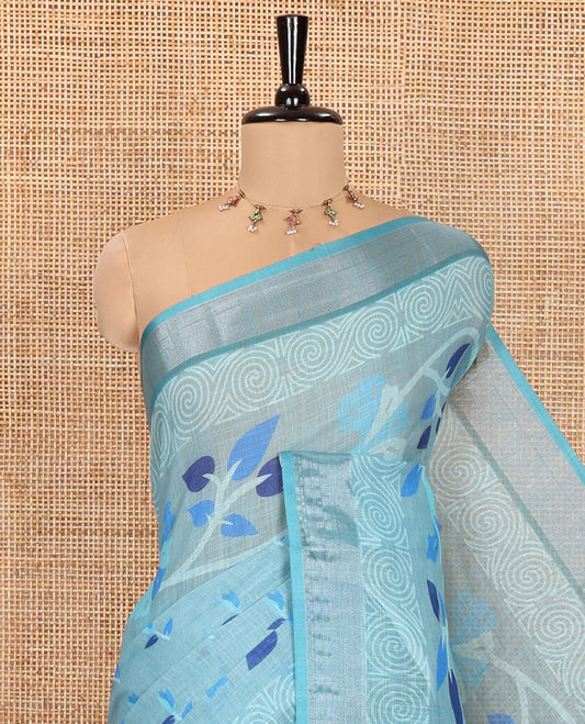 Blue Linen Cotton Saree, Prettified with Leaf Vine Printed on Its Body, Contrast Bavanji Border, Printed Pallu, and Paired with a Contrast Blouse