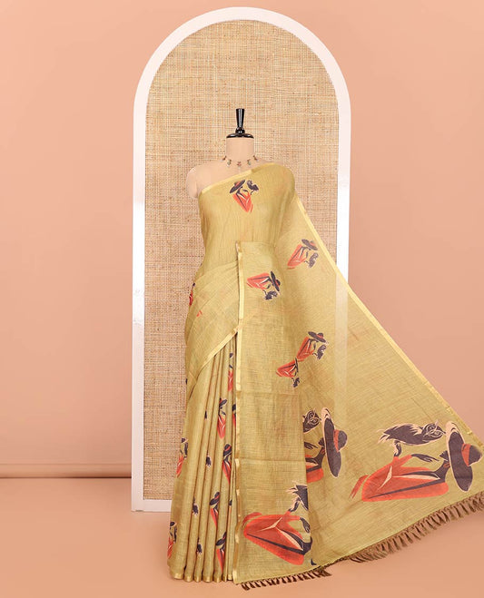 Green Linen Cotton Saree, Elevated with Girl Motifs Printed on Its Body, Subtle Zari Piping Border, Pallu Mirrors the Same Print, and Comes with a Matching Printed Blouse
