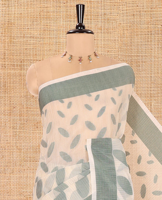 Chikku and Green Manipuri Cotton Saree, Steeped with Leaf Motifs Printed on Its Body, Contrast Plain Border, Captivating Contrast Plain Pallu, and Paired with a Matching Blouse