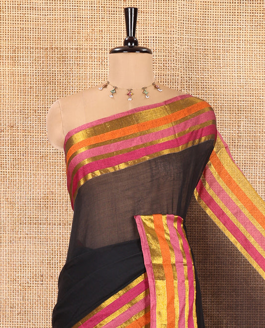 Black Plain Khadi Mul Cotton Saree, Complemented by Contrast Pink-Orange Zari Striped Border, Self-Pallu, and Paired with a Matching Blouse