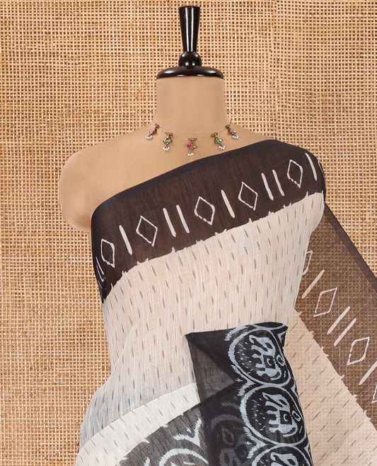 Cream and Black Linen Cotton Saree, Subtly Steeped with Raindrop Style Buttas All Over Its Body, Complemented by Contrast Ikkat Style Border of Elephant Motifs, Ikkat Style Pallu, and Paired with a Contrast Blouse