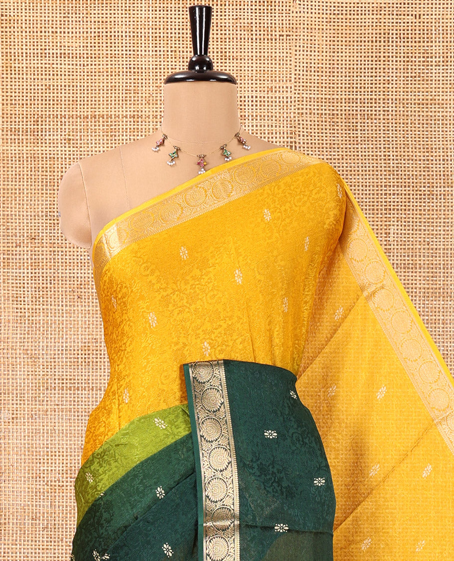 Yellow and Green Candy Chiffon Saree, Bedecked with Floral Vine Embossed, Buttas, and Ombre-Style Dyed on Its Body, Highlighted by Floral Creeper Zari Border, Intricately Designed Pallu, and Paired with a Contrast Blouse