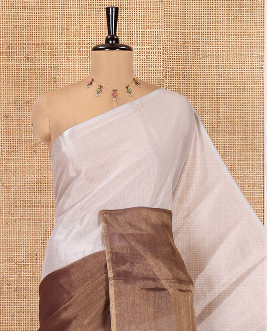 Borderless Brown Plain Tissue Saree, a Self-Pallu with Tassels, and a Matching Blouse