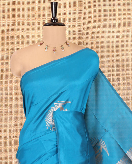 Borderless Peacock Blue Kanchi Silk Saree, Opulently Embellished with Zari Buttas, Intricate Pallu, and a Matching Blouse