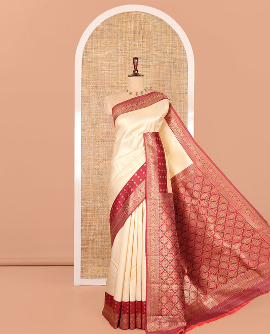 Cream-Maroon Embossed Art Kanchi Silk Saree, a Contrast Traditional Zari Border, Grand Jaal Pallu, and a Contrast Blouse
